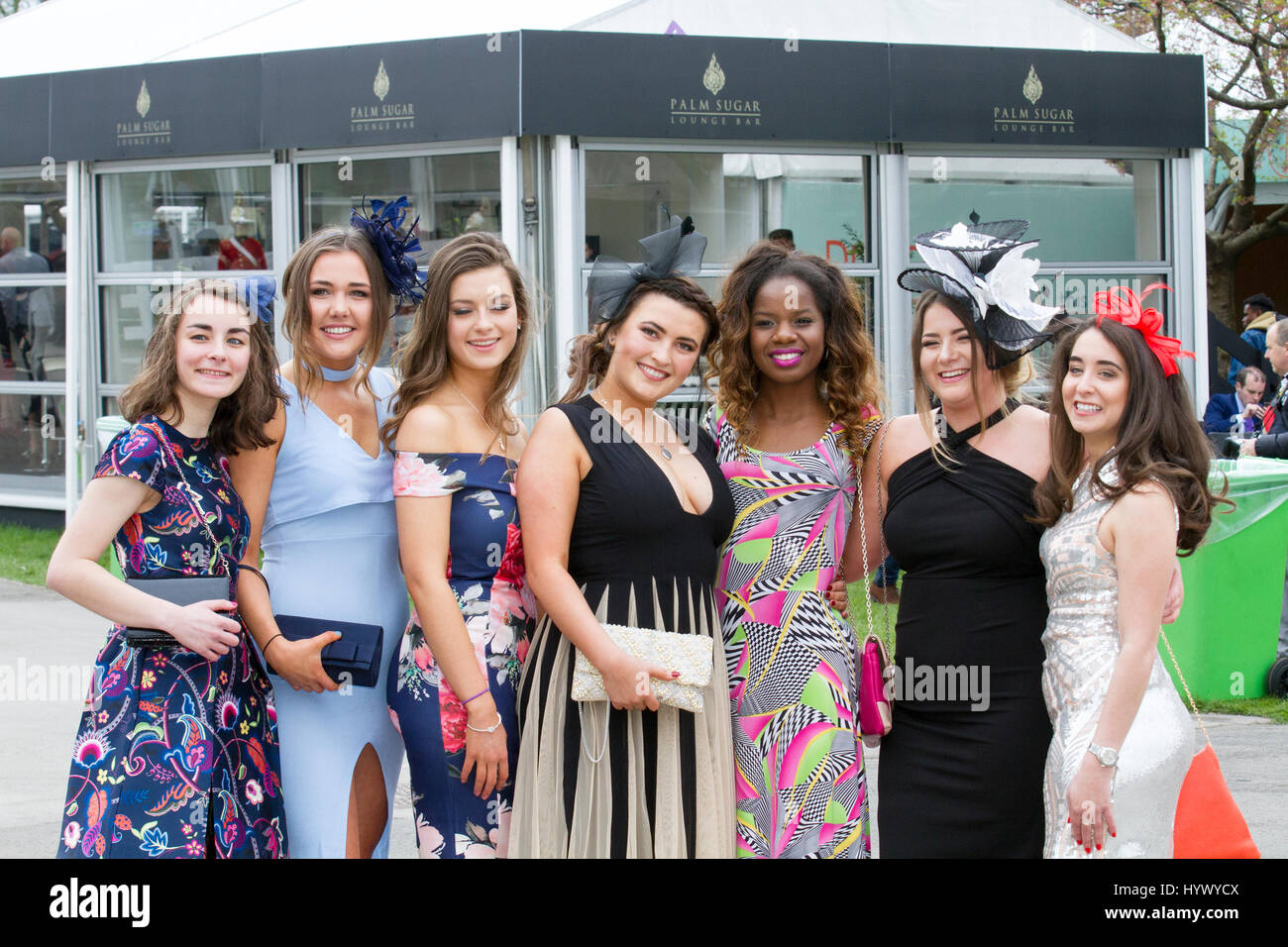 Racegoers' female fashions, high-fashion clothing, stylish, geek chic trendy, formal ladies frocks, haute couture dresses and fashionistas in Liverpool, Merseyside, UK April 2017. Grand National Ladies Day at Aintree. In light of previous years, when attendee’s outfits have got attention for all wrong reasons, officials at the Grand National urged this year's racegoers to 'smarten up' to make the event more 'aspirational'. Stock Photo