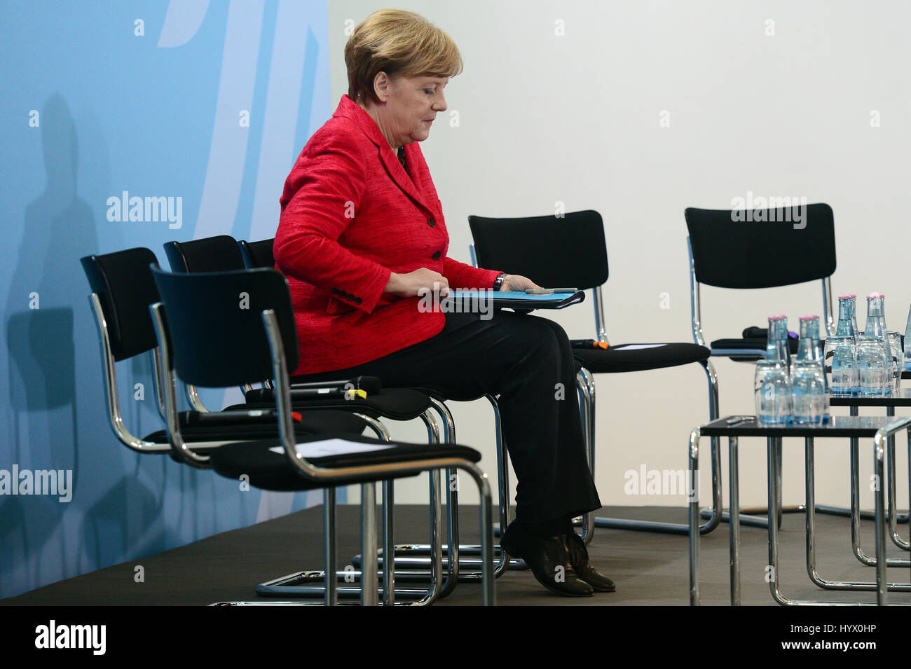 Berlin, Germany. 7th Apr, 2017. German chancellor Angela Merkel sits during an event hosted in the honour of voluntary workers in refugee aid at the federal chancellery in Berlin, Germany, 7 April 2017. Photo: Maurizio Gambarini/dpa/Alamy Live News Stock Photo