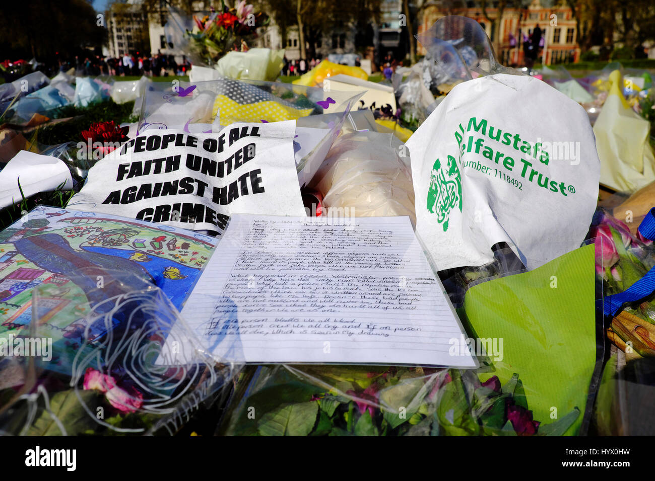 London, UK. 7th April 2017. A moving letter from 8 year old Sala-Al-Salami lies amongst the floral tributes laid down on Parliament Square. Police announced today that 31 year old Andreea Cristea has died as a result of her injuries two weeks on from the attack. Credit: Paul Swinney/Alamy Live News Stock Photo