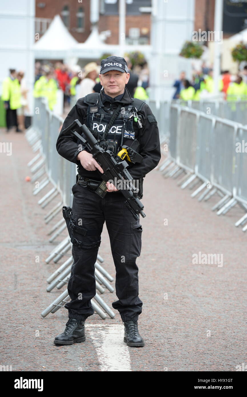 Liverpool, UK. 07th Apr, 2017. Armed Police keep an eye on guests as they arrive for Ladies Day at Aintree Racecourse, This Year is the first time in the race meeting's 170-year history that there have been armed patrols. Liverpool, Friday 7th April 2017 Credit: stephen searle/Alamy Live News Stock Photo