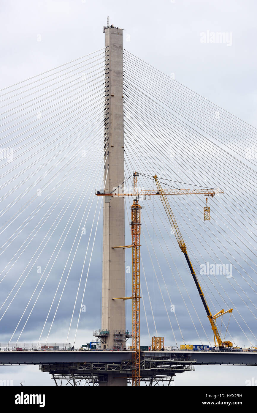Edinburgh, Scotland, United Kingdom. 7th April, 2017. Intermittent progress continues on dismantling the construction cranes on the Queensferry Crossing which spans the Forth Estuary near Edinburgh. High winds through the winter have disrupted progress on the work, which has been a factor in the delay in the planned opening of the bridge until August 2017. Credit: Ken Jack/Alamy Live News Stock Photo