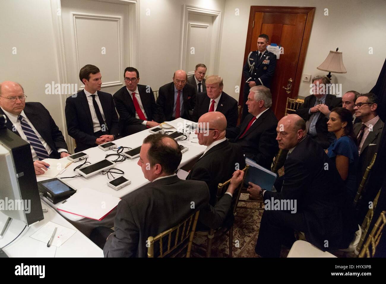 Palm Beach, United States Of America. 07th Apr, 2017. U.S President Donald Trump, center, is briefed by his National Security team as Navy launches 59 Tomahawk cruise missiles at Shayrat airbase in Syria in a secured location at Mar-a-Lago April 6, 2017 in Palm Beach, Florida. Sitting with the president L-R are deputy chief of staff for operations Joe Hagin, advisor Jared Kushner, Treasury Secretary Steve Mnuchin, Commerce Secretary Wilbur Ross, Secretary of State Rex Tillerson and national security adviser H.R. McMaster and chief of staff Reince Priebus. Credit: Planetpix/Alamy Live News Stock Photo
