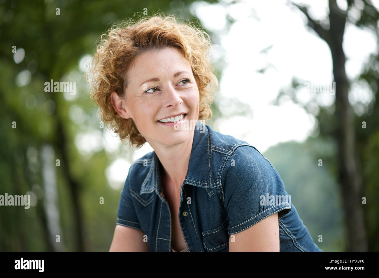 Beautiful mature woman smiling hi-res stock photography and images - Alamy