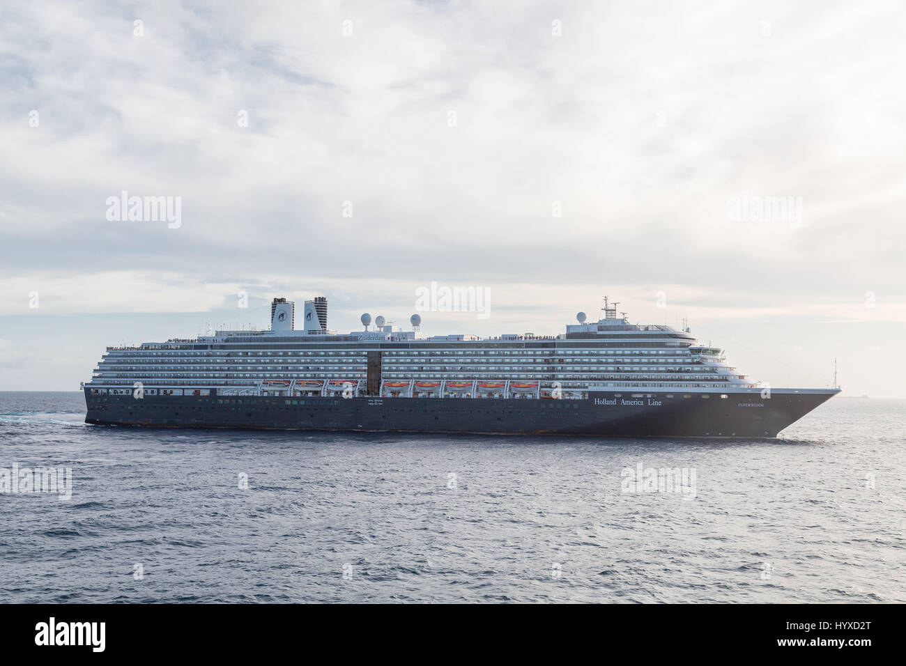 Huge black and white luxury cruise ship sailiing off Stock Photo - Alamy