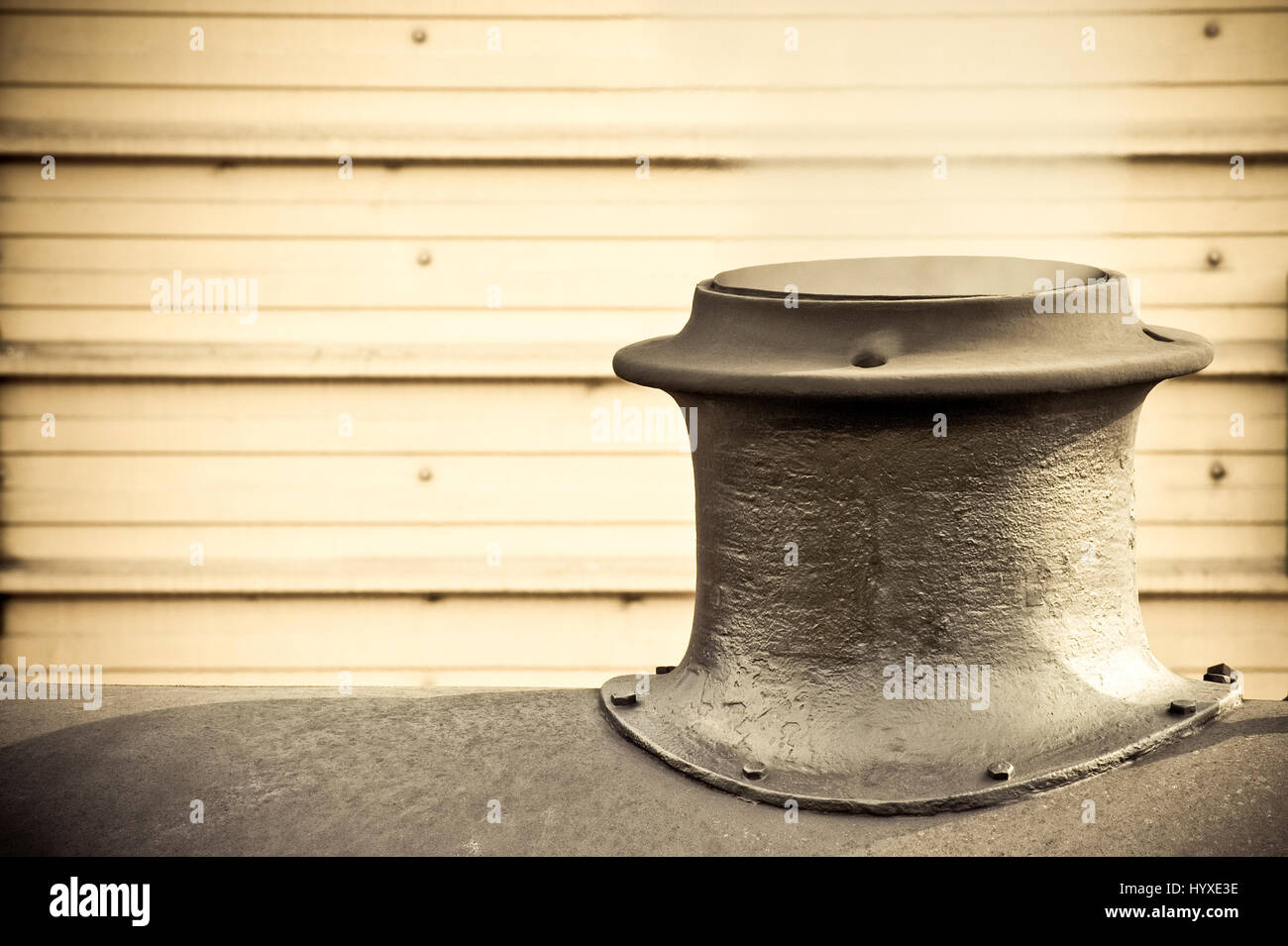 steam escaping from the funnel of a vintage railroad engine Stock Photo