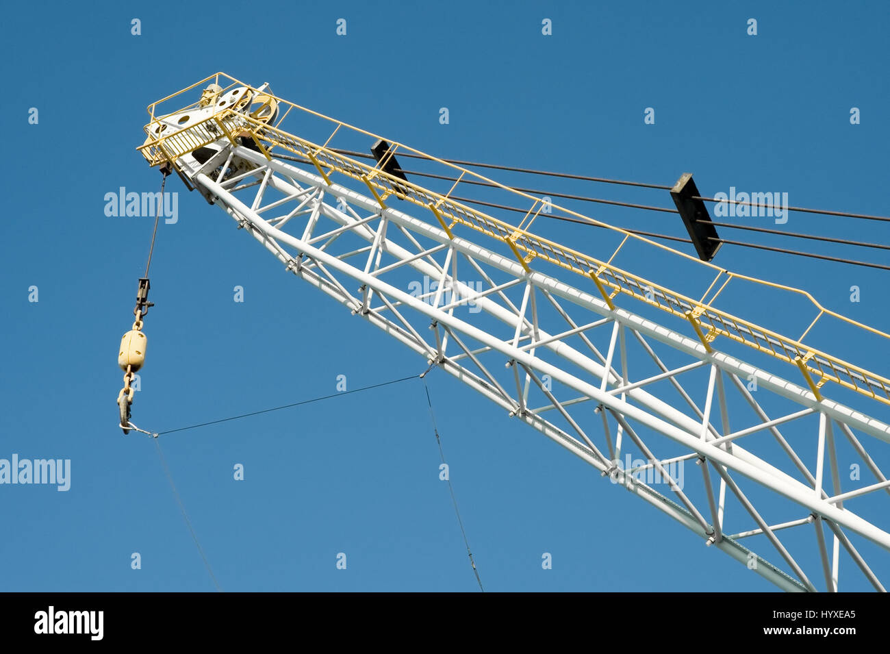 dockyard cargo crane detail against a blue sky Stock Photo - Alamy