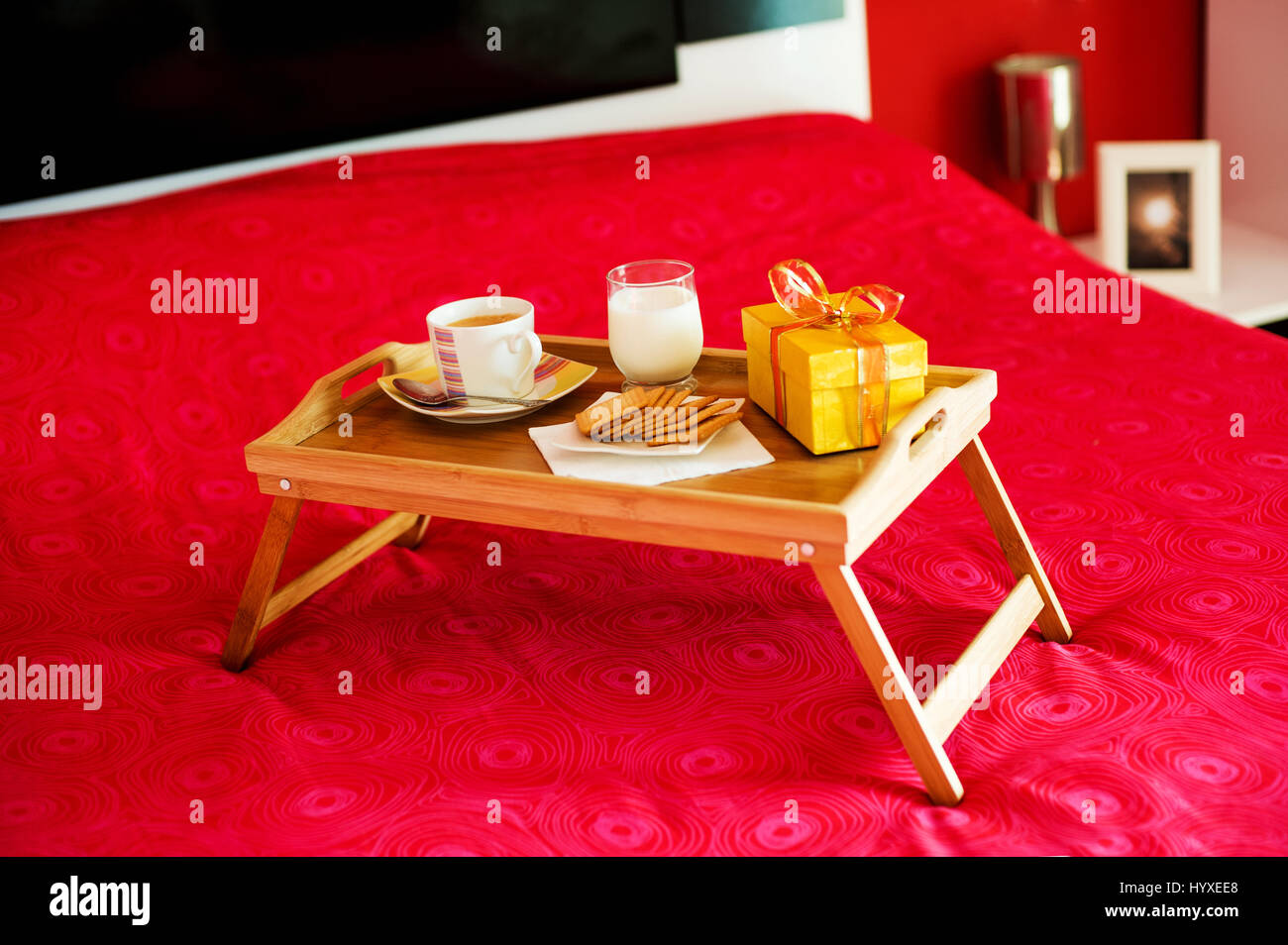 Breakfast tray on the bed and a gift Stock Photo Alamy