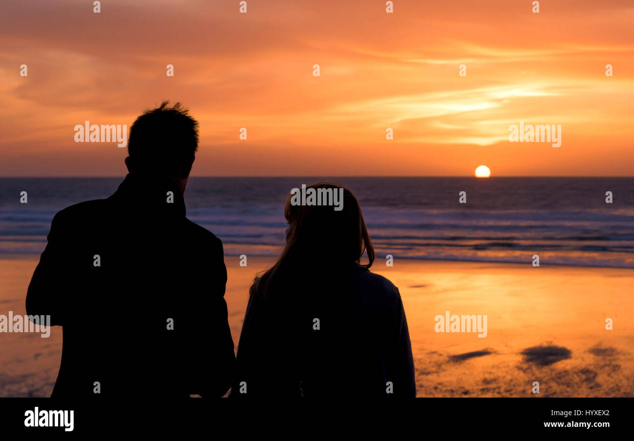 Sunset People Silhouette Couple Seaside Setting sun Coast Fistral Beach Evening End of the day Dusk Sea Ocean Leisure time Tourism Stock Photo