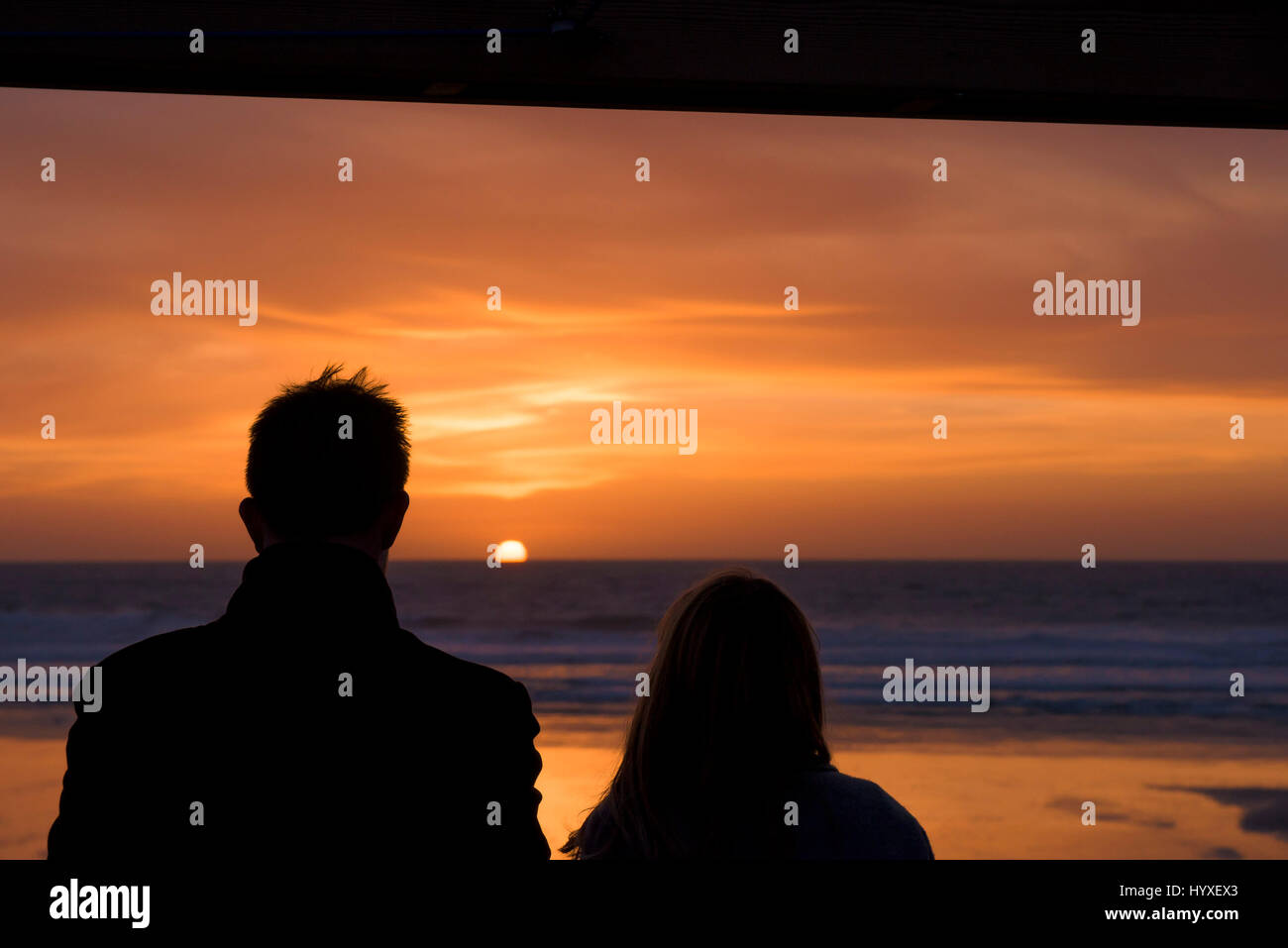 Sunset People Silhouette Couple Seaside Setting sun Coast Fistral Beach Evening End of the day Dusk Sea Ocean Leisure time Tourism Stock Photo