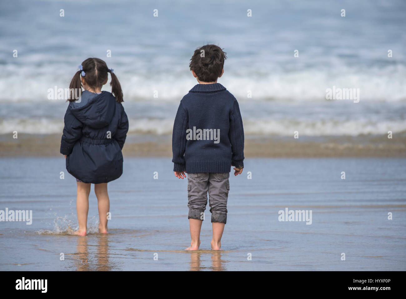 Children Seaside UK Brother Sister Siblings Sea Paddling Shore Shoreline Holidays Vacation Cornwall Stock Photo