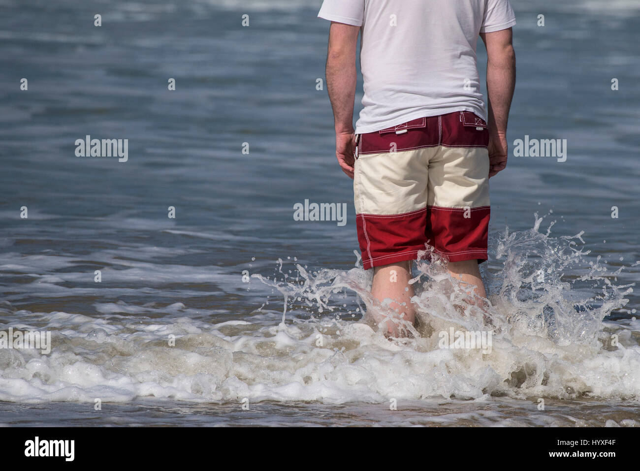 Holidaymaker Tourist Sea Seaside Paddling Cooling off Standing in the sea Tourism Holiday Cornwall Vacation Visitor Stock Photo