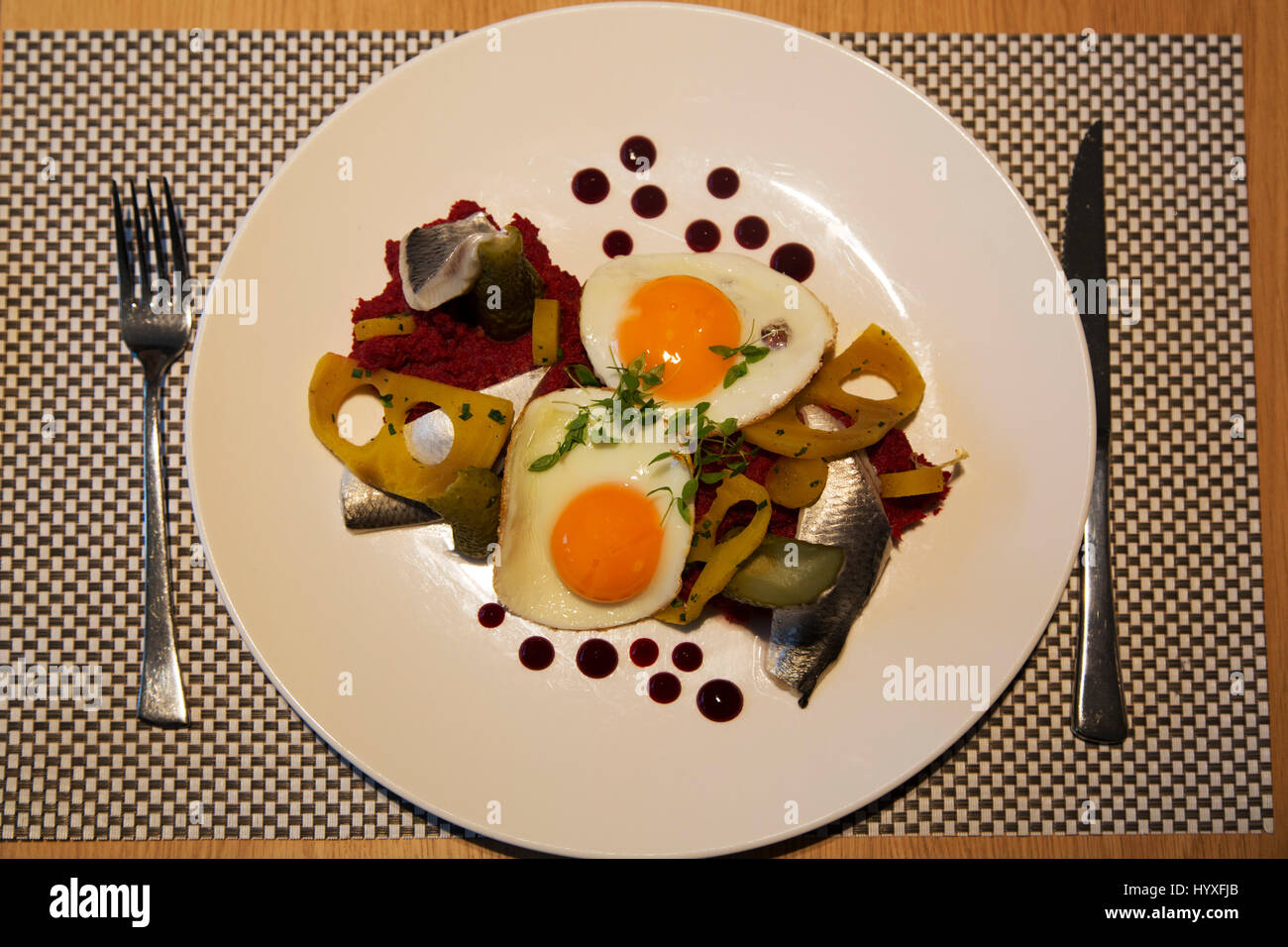 Labskaus, a traditional stew, served in Hamburg, Germany. The dish, features fish, potato, beetroot and meat topped with fried egg. Stock Photo