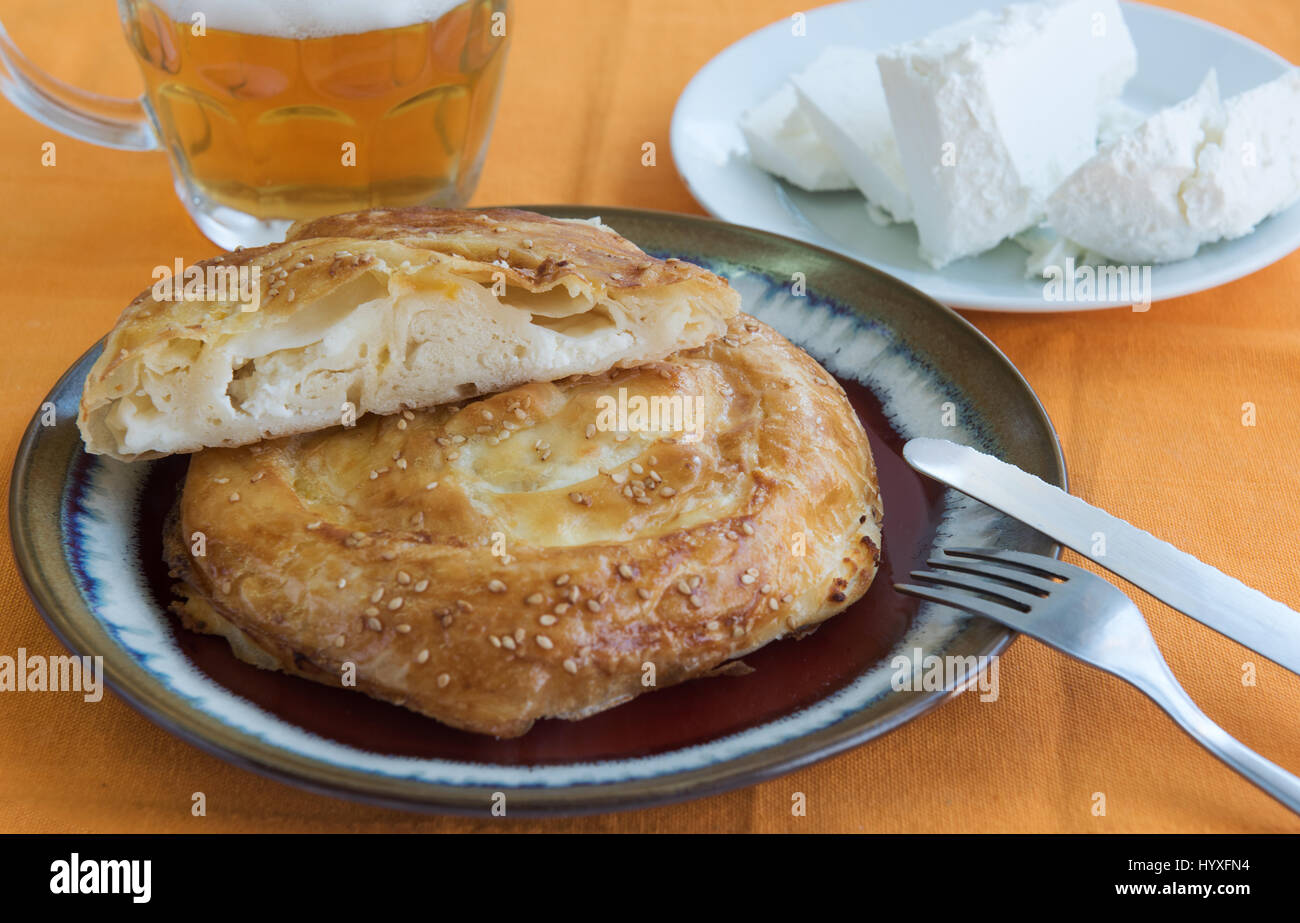 Roll with cheese on an orange background Stock Photo