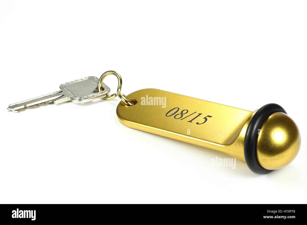 08/15 hotel key isolated on white background. 08/15 is a (German) phrase and means ordinary/ unspectacular. Stock Photo