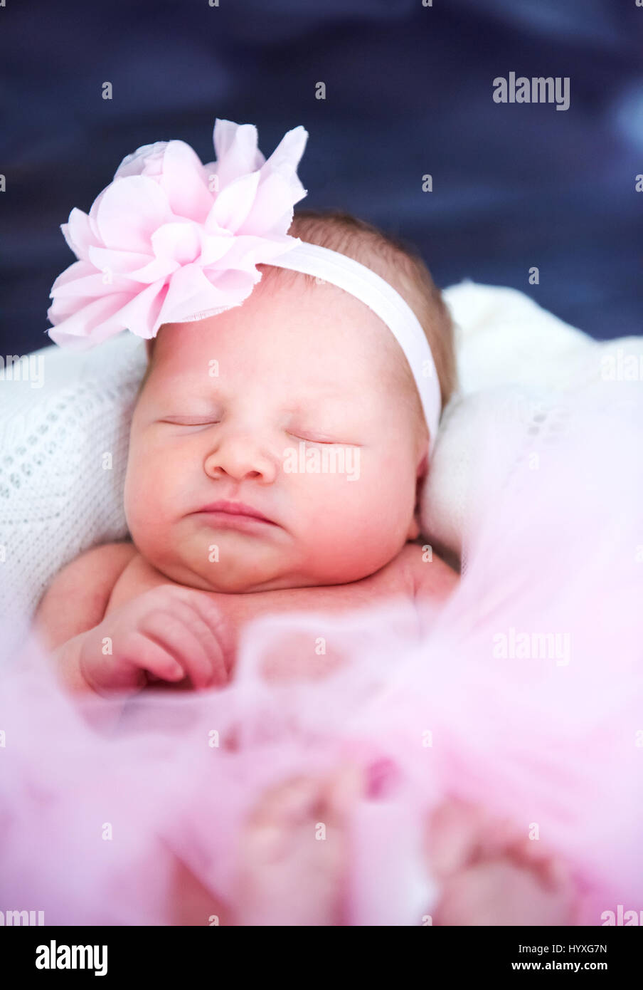 cute newborn baby sleeping in a basket Stock Photo