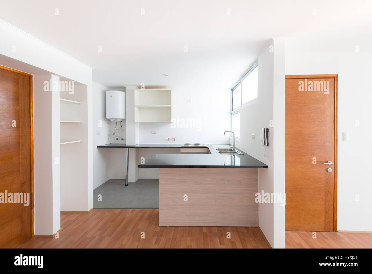 Kitchen of a small one bedroom empty apartment Stock Photo