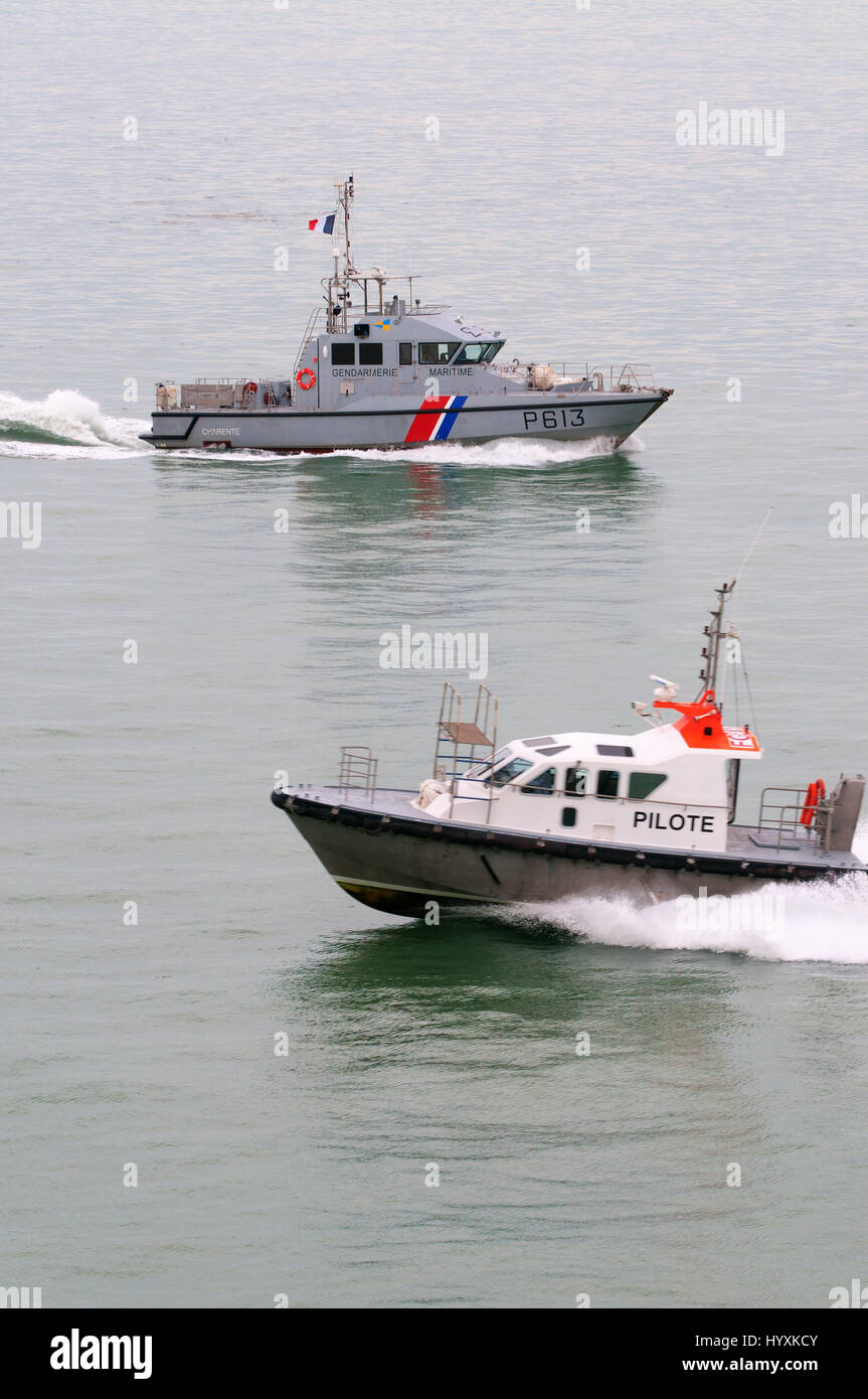 European - Gendarmerie Maritime Charente P613 high performance boat, with passing very fast EU Pilot boat in the foreground Stock Photo