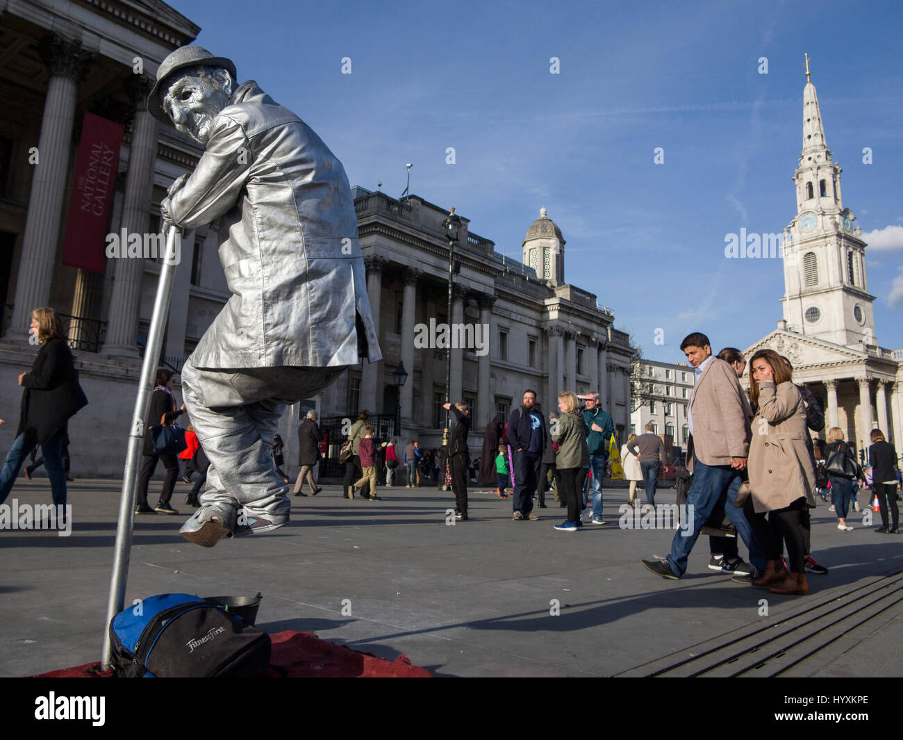 A street perform levitates outside the National Gallery in London Stock