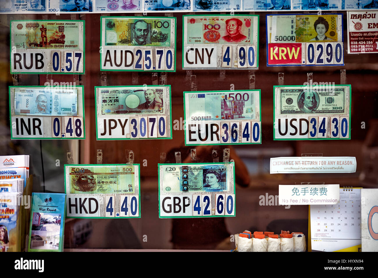 Foreign currency notes at a money exchange kiosk. Thailand Southeast Asia Stock Photo