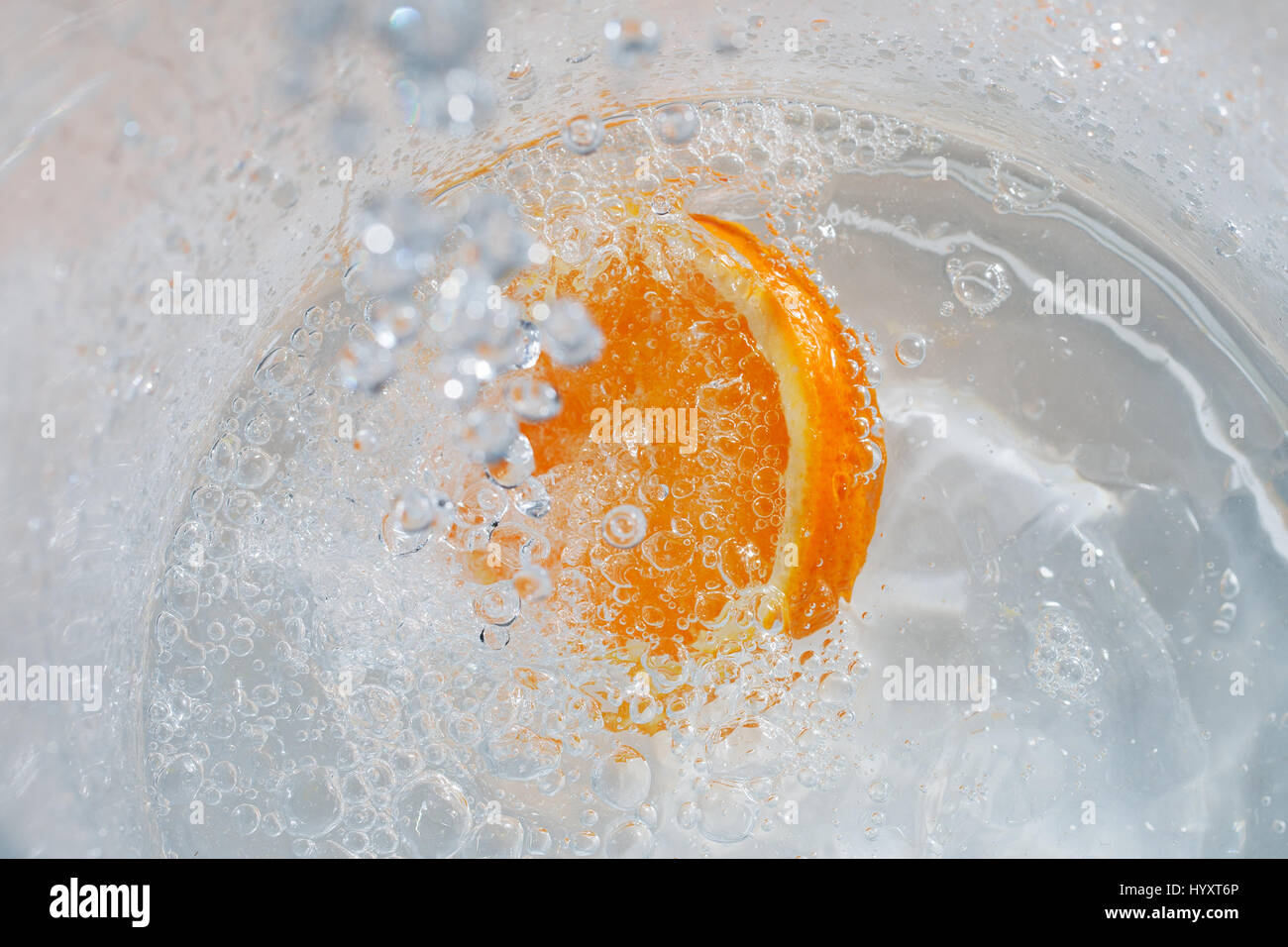 Orange in splashing water Stock Photo - Alamy