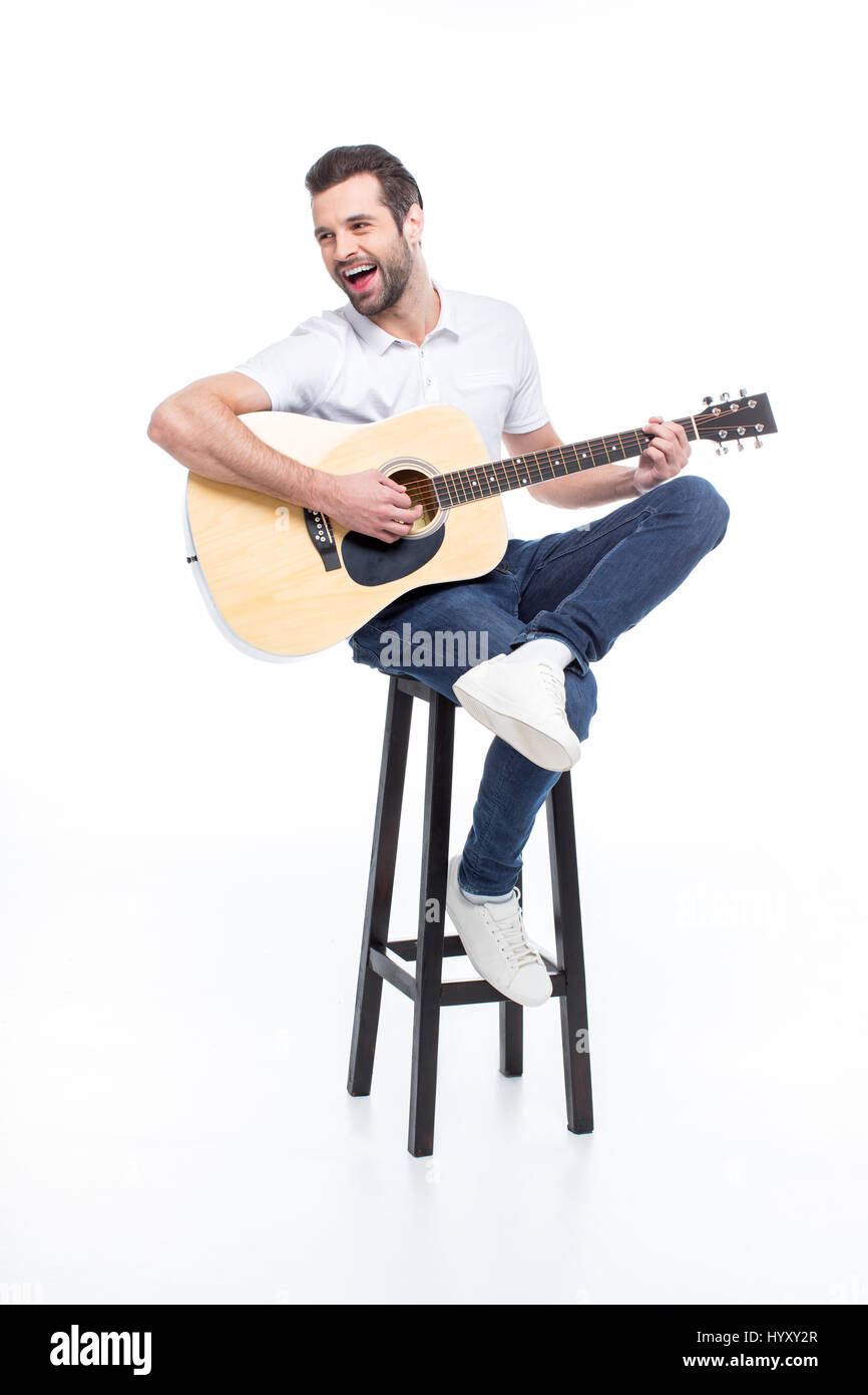 Playing guitar sitting on stool hires stock photography and images Alamy