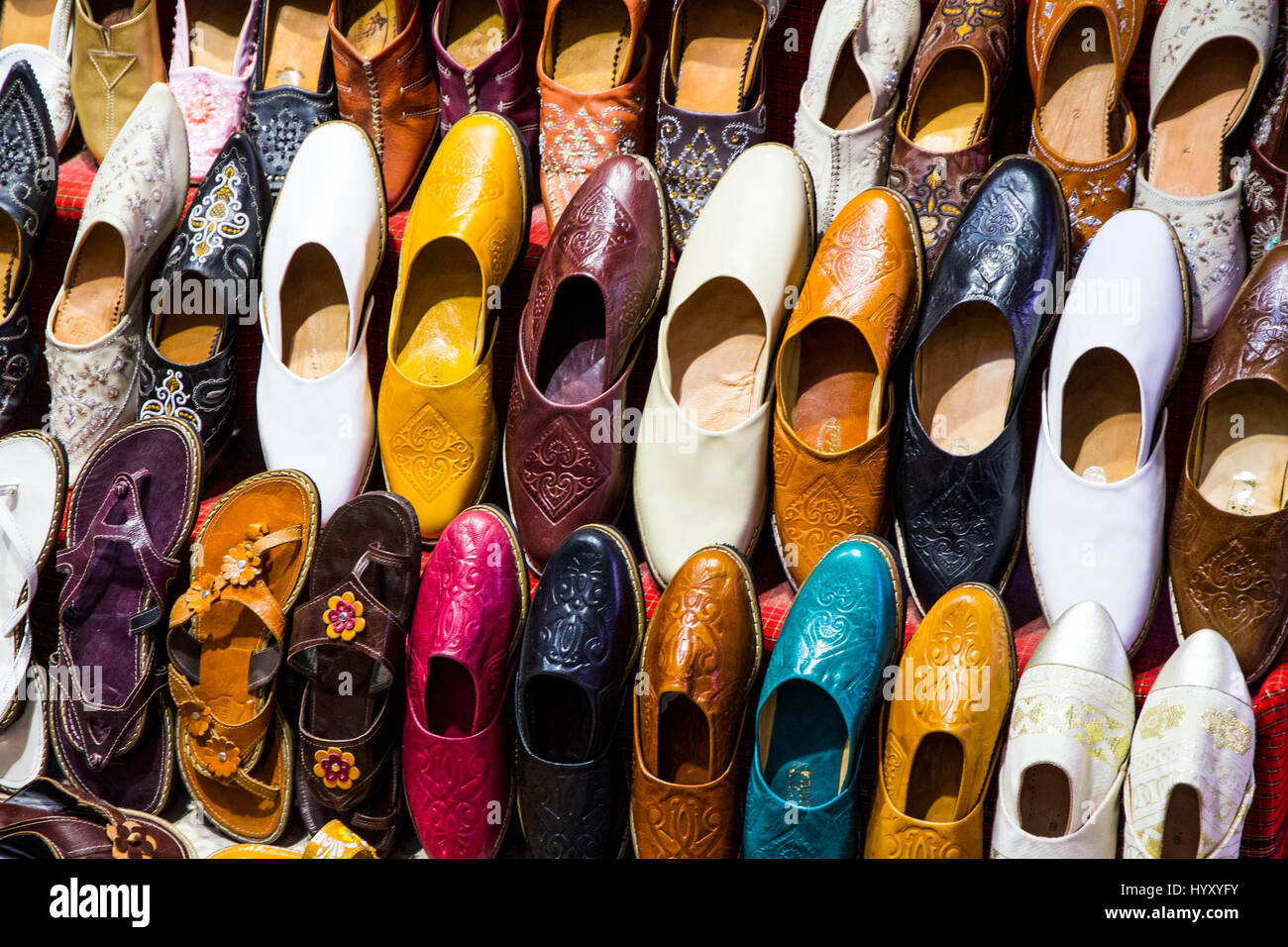 This souk, or shop, displays an array of colorful handmade shoes and sandals in the Medina of Tunis, Tunisia. Stock Photo