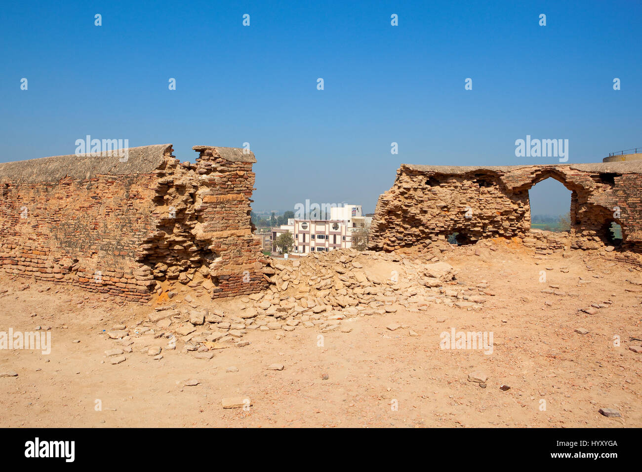 broken walls in need of restoration at bhatner fort hanumangarh rajasthan india under a clear blue sky Stock Photo