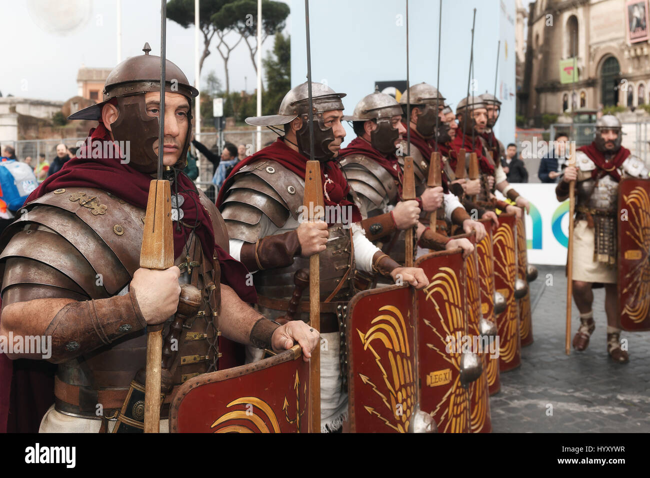 Rome, Italy - April 2nd, 2017: Gladiators in line with the typical clothing, helmet and spear. They await the start of the marathon. Stock Photo