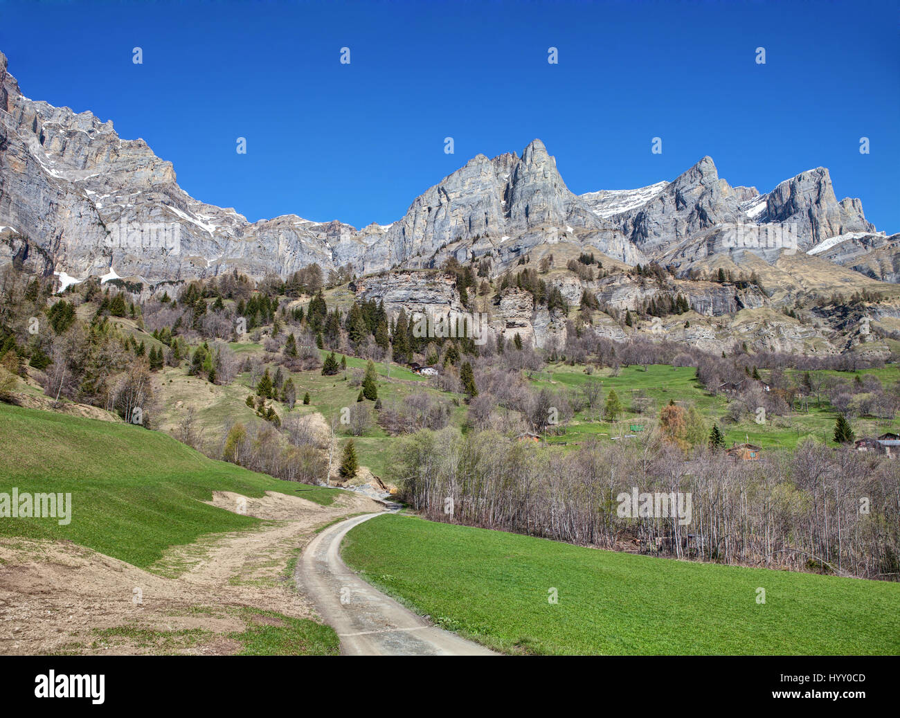 The country road   in the neighborhood of Leukerbad village at early spring, canton of Valais, Switzerland Stock Photo