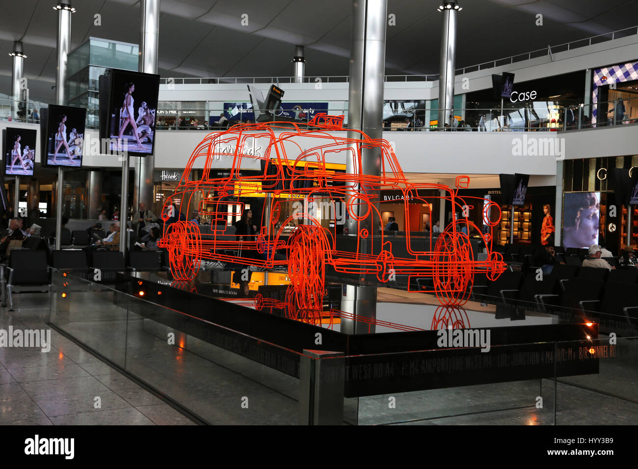 England Heathrow Airport Terminal Two Departure Lounge With Art Work Of A London Taxi Stock Photo