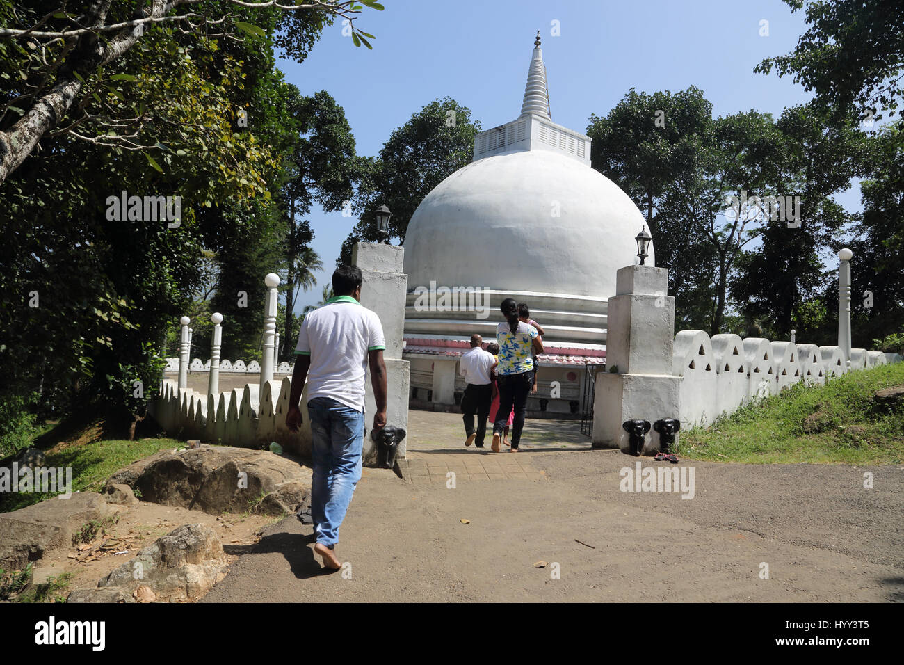 Aluviharaya Rock Cave Temple Sri Lanka Matale District Kandy-Dambulla Highway Visitors Walking Towards Dagoba Stock Photo