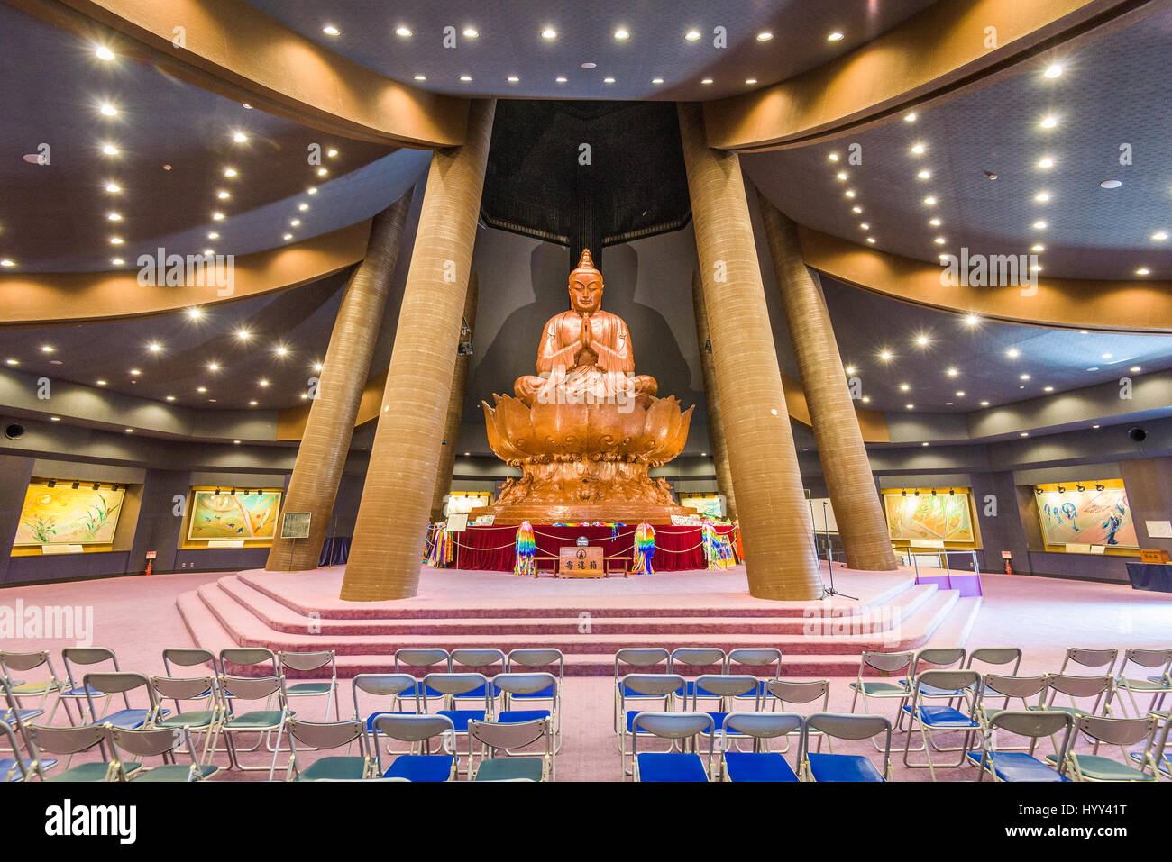 ITOUMI, OKINAWA, JAPAN - MARCH 24, 2017: The giant Buddha inside Okinawa Peace Memorial Hall. The Memorial Hall is part of Peace Memorial Park which i Stock Photo