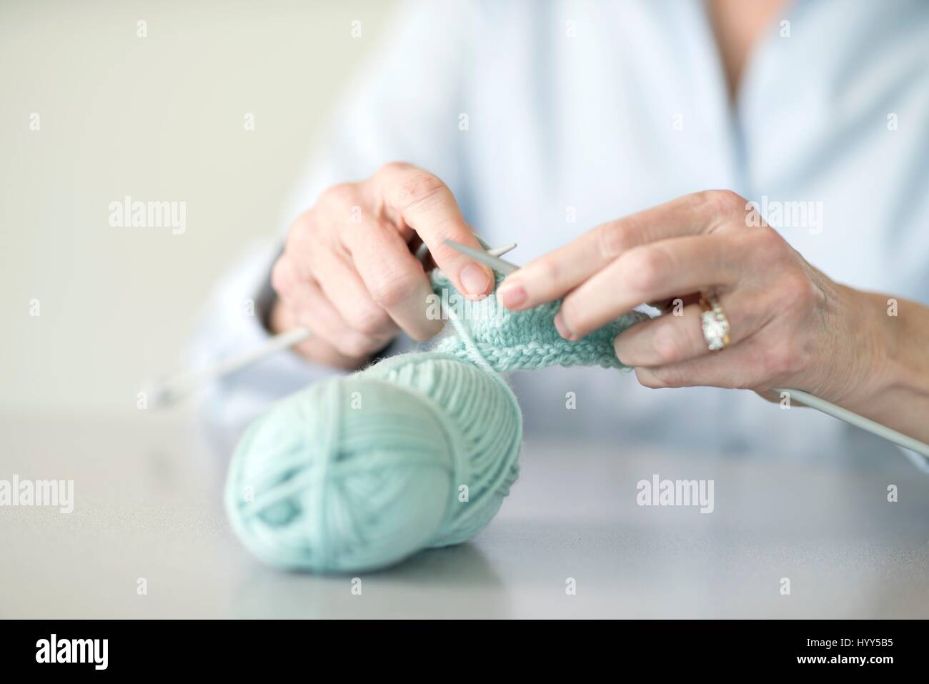 Senior woman knitting. Stock Photo