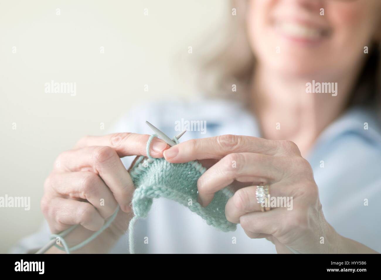 Senior woman knitting. Stock Photo