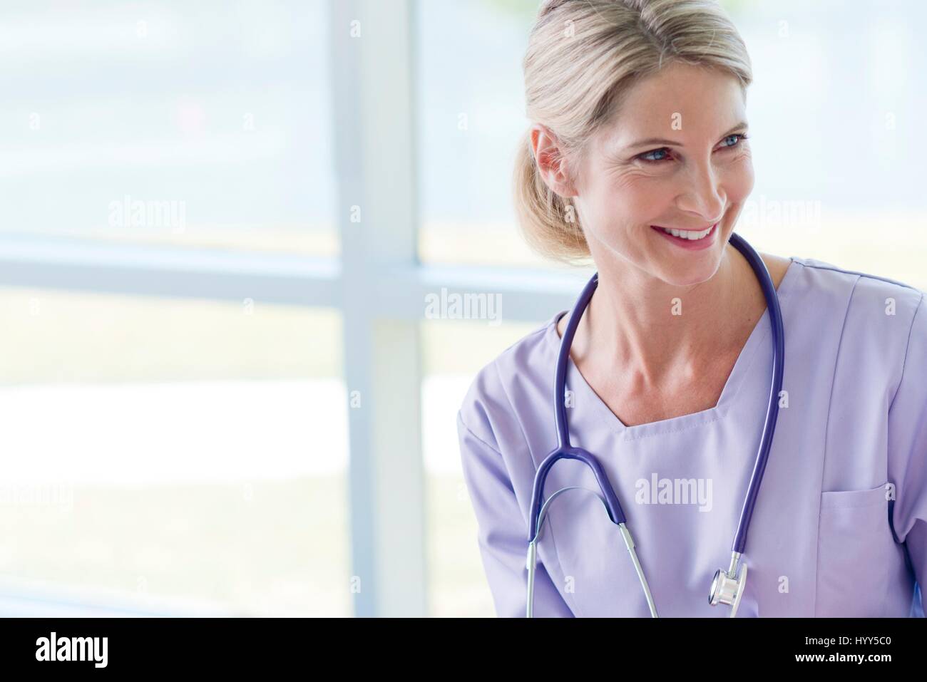 Care worker smiling. Stock Photo