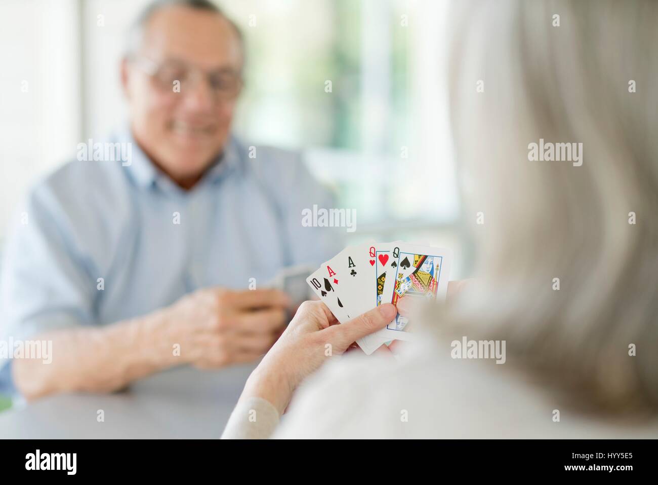 Senior couple playing cards. Stock Photo