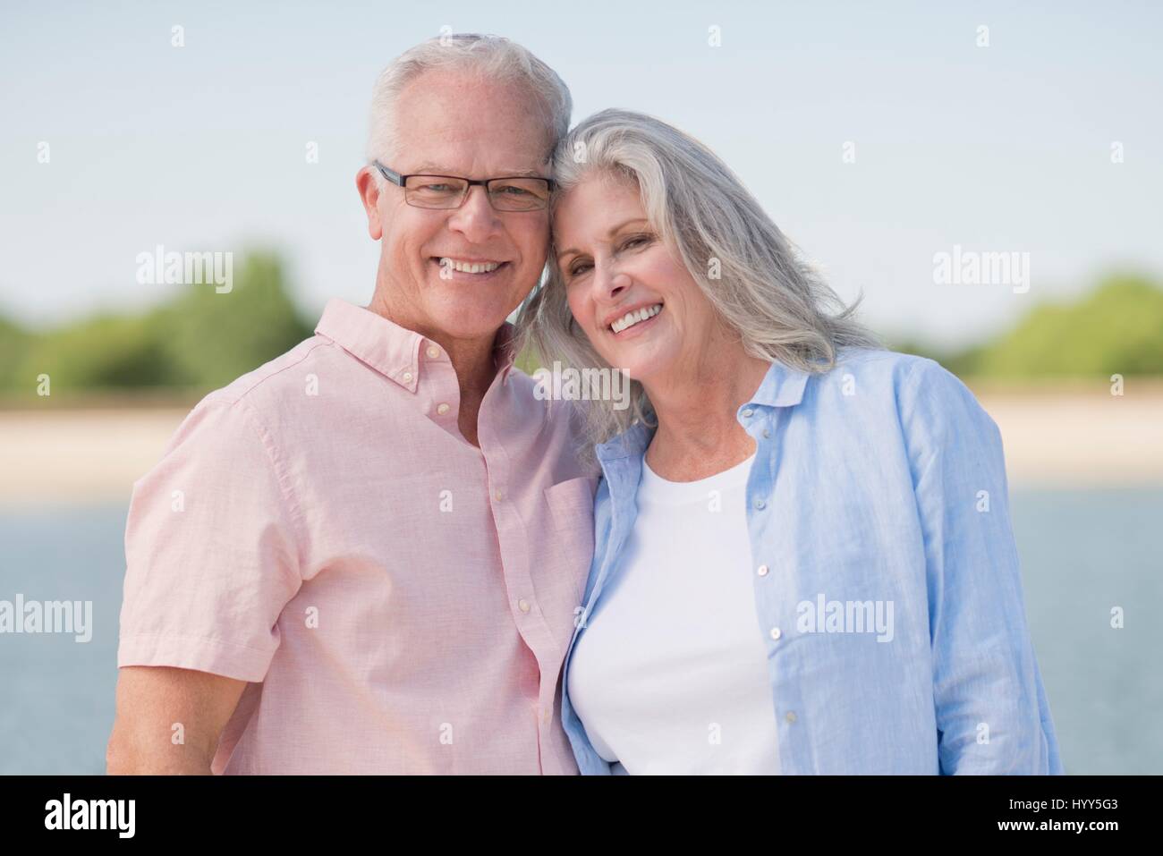 Senior couple smiling outdoors. Stock Photo