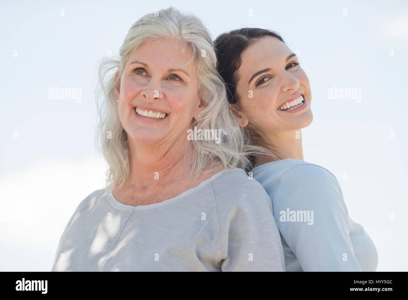 Senior woman with daughter smiling to camera, portrait. Stock Photo