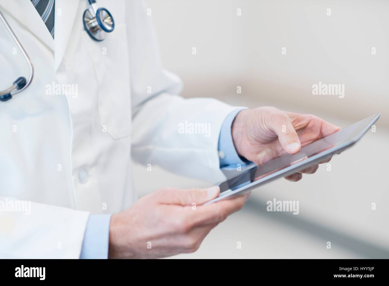 Male doctor using digital tablet. Stock Photo