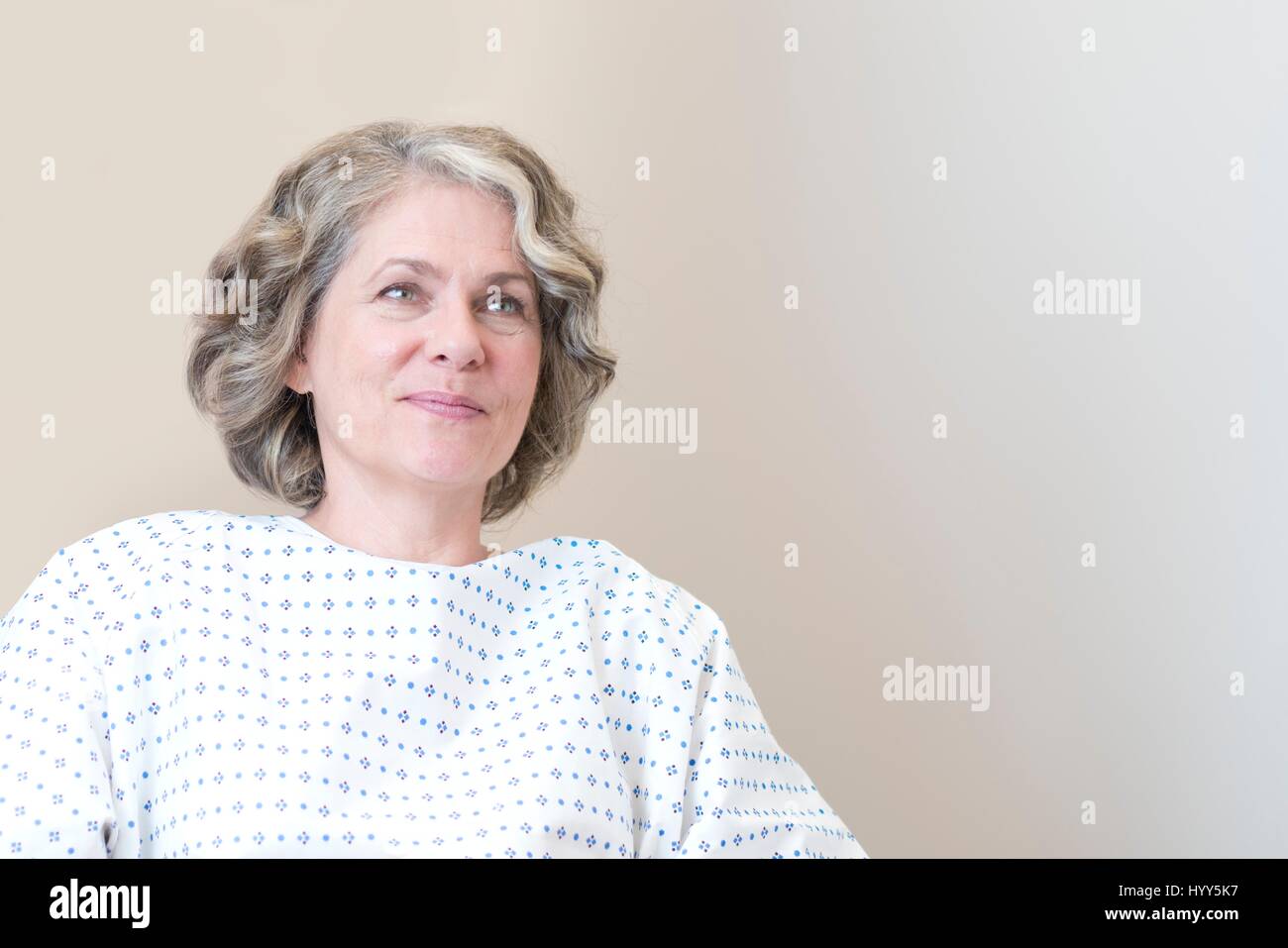 Mature women in hospital gown. Stock Photo