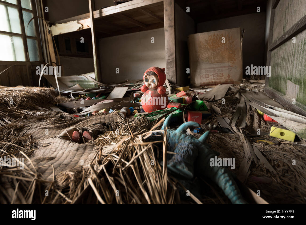 JAPAN: EERIE images have revealed the crumbling remains of the uninhabited Japanese mining island that was featured in the James Bond hit film Skyfall. The ghostly pictures show dilapidated high rise buildings where mine workers once lived and water filled foundations that have crumbled away. Other shots show how families left their belongings behind with children’s toys and even a television scattered amongst the debris. One image taken from the sea surrounding the island shows it in complete darkness. The haunting photographs were taken at Hashima Island, also known as Battleship Island, Jap Stock Photo