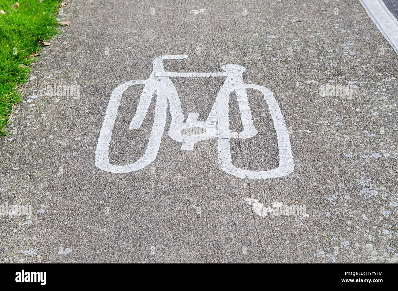 Cycle path with picture of bicycle painted on tarmac Stock Photo