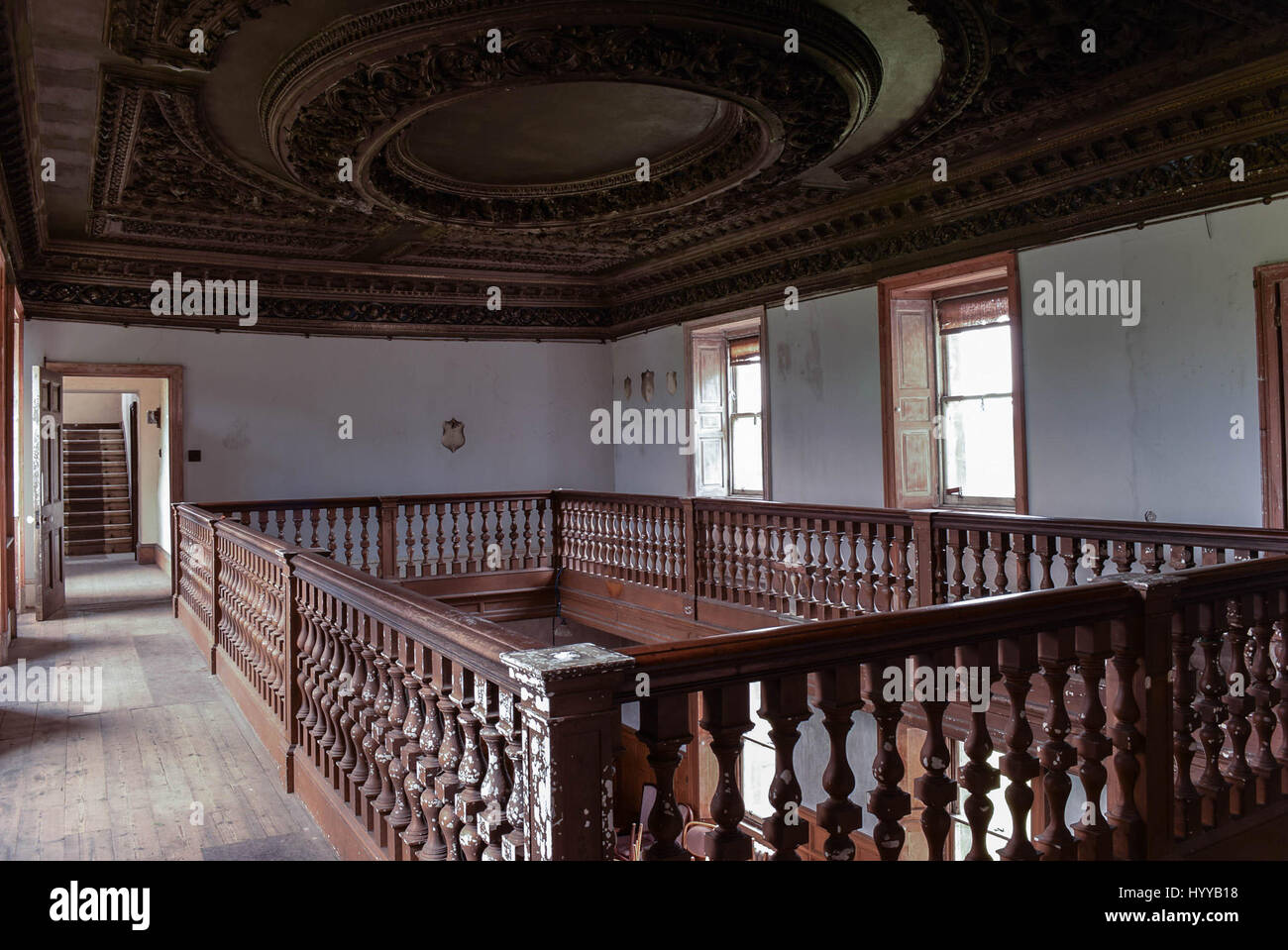 SCOTLAND, UNITED KINGDOM: STUNNING pictures offer a glimpse inside the decrepit Scottish mansion where Bonnie Prince Charlie once made his headquarters now on the open market for £1.25million despite efforts of a local trust to secure the historic building for the nation. The atmospheric images show the original four-poster bed that Prince Charles Edward Stuart slept in, and possibly sired his only daughter on, chipped banisters and a neglected snooker table with vintage scoreboard.  Other photos show a corridor of what would have been servants’ rooms and what looks like a utility room. The ho Stock Photo