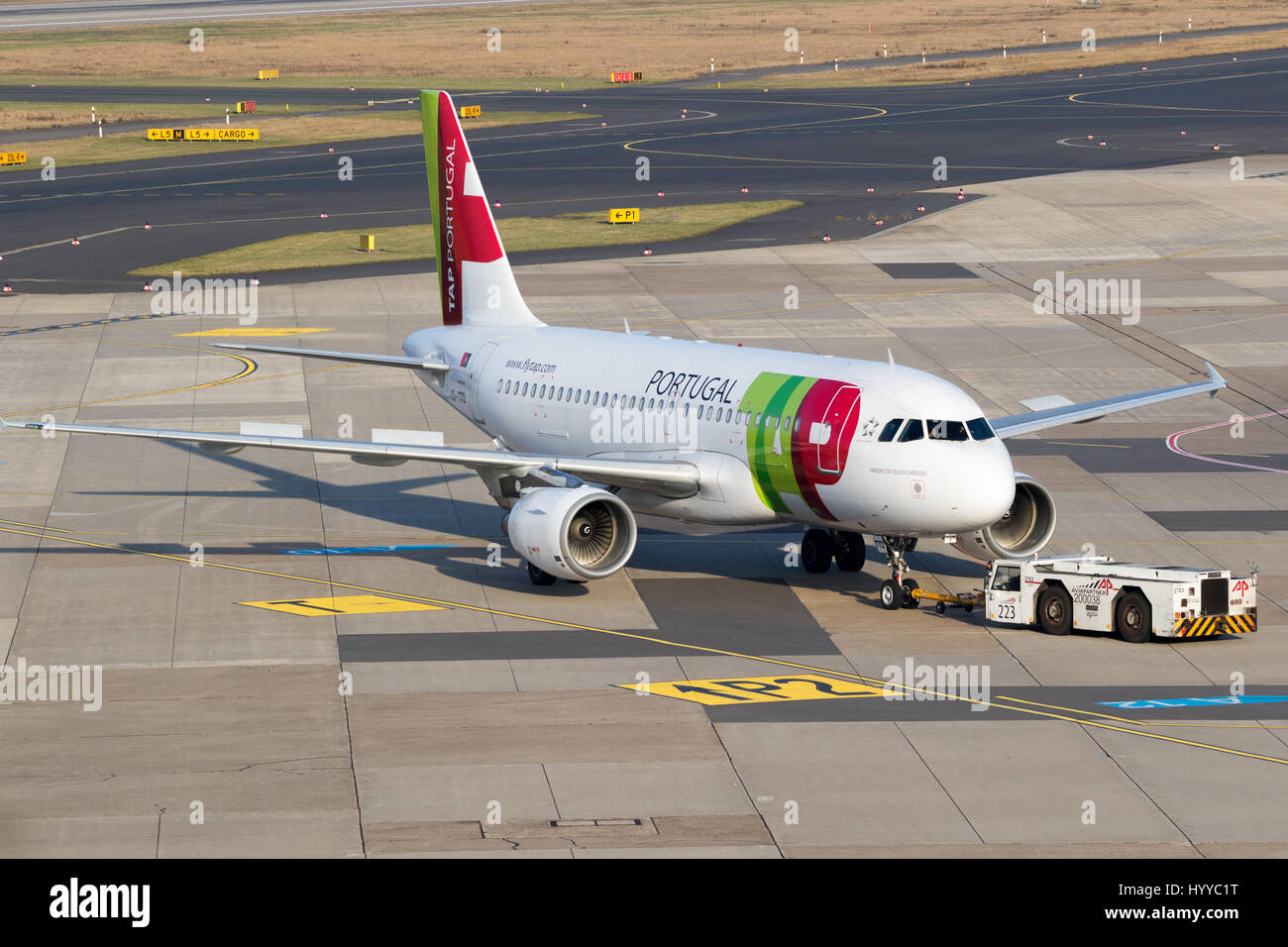 DUSSELDORF, GERMANY - DEC 16, 2016: Airbus A319 plane from TAP Air Portugal taxiing to the gate after landing on Dusseldorf airport Stock Photo