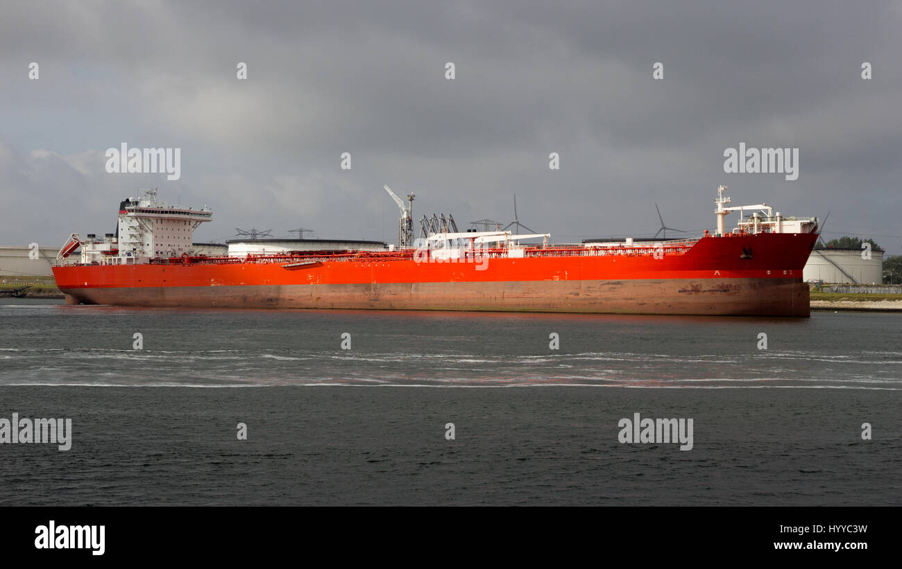 Red oil tanker moored at an oil terminal in the Port of Rotterdam. Stock Photo