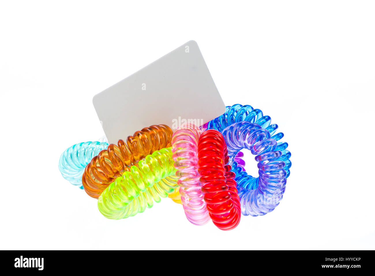 Isolated bunch of  various spiral hair ties with price tag Stock Photo