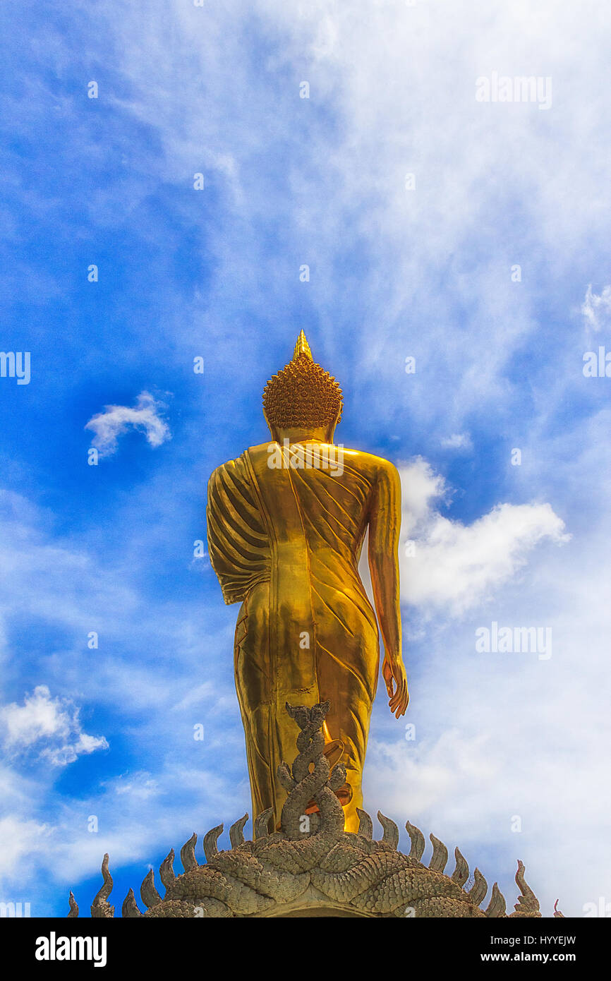 Golden Buddha Statue and blue sky in thai temple, Wat Phra That Khao ...