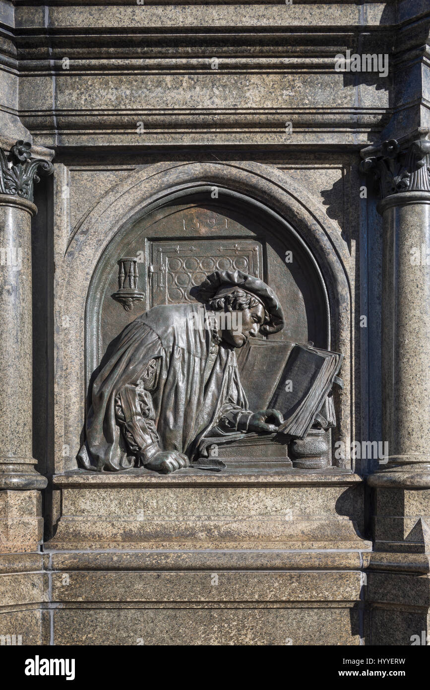 Relief at Luther Memorial, 1883, Luther translating Bible at the Wartburg, Luther Eisleben, Saxony-Anhalt, Germany Stock Photo