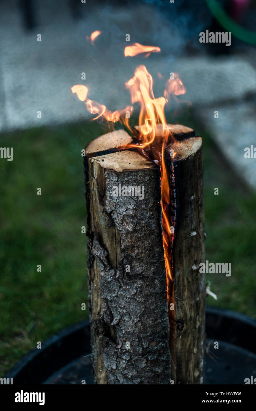 Swedish torch fire burning stub on a plate for rest or to cook food