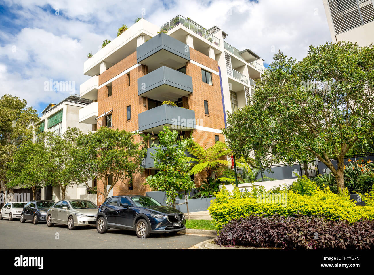 Apartment building with on street car parking in Sydney eastern suburbs,Australia Stock Photo